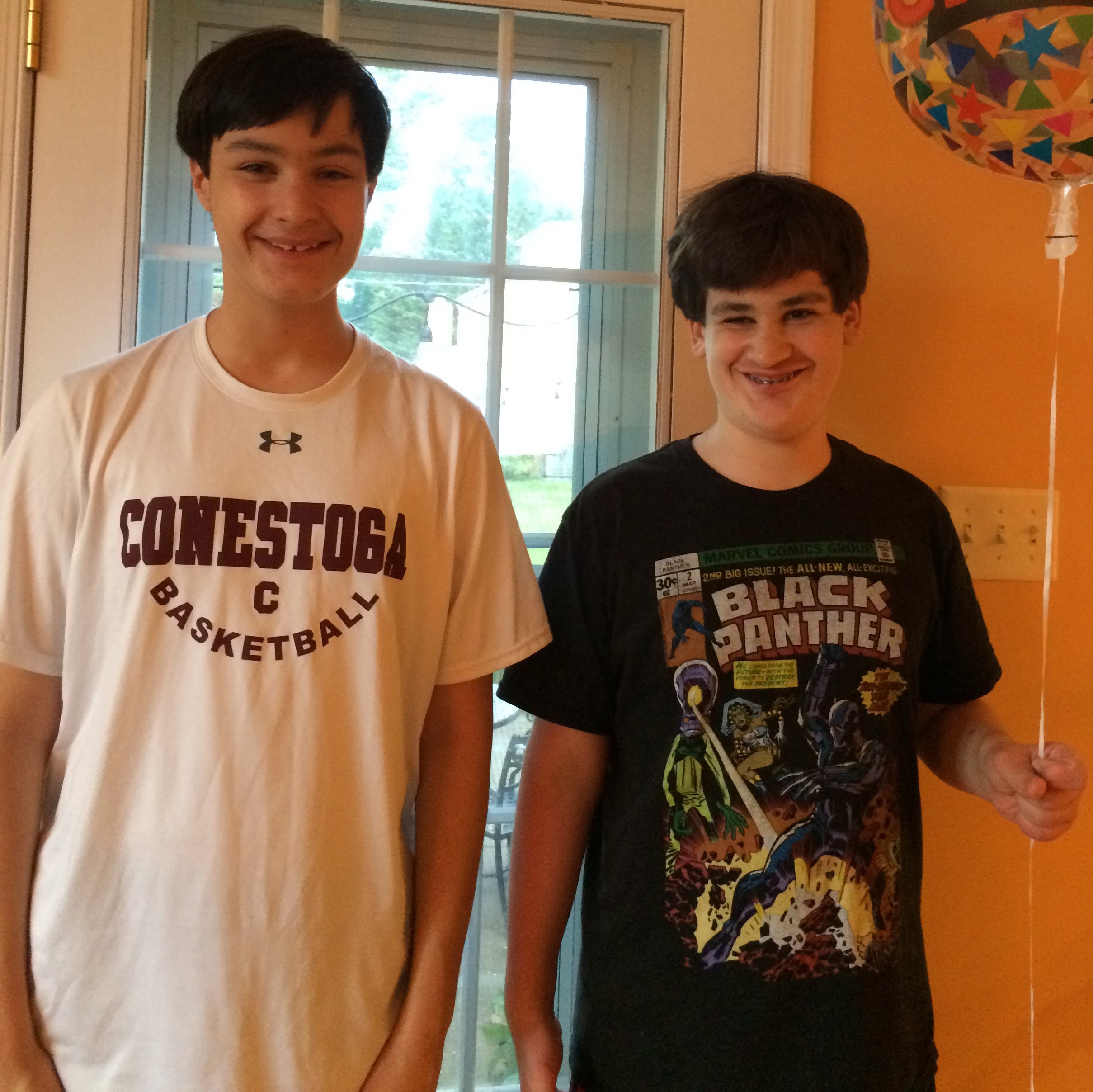 Andrew and Jason standing and smiling