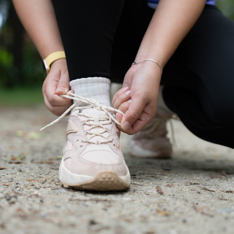 Person Tying shoe laces